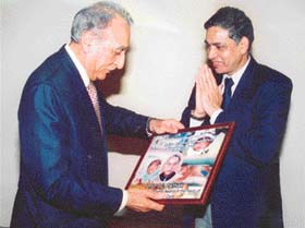 Prof I.C. Pathak receives an award from the Director, PGI, Prof K.K. Talwar