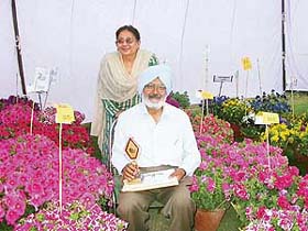 Mr S.S. Gill and his wife with some of their award-winning entries at the Guldasta flower festival that concluded in Mohali
