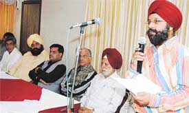 Mr Amarvir Singh, general secretary of the Punjab State Fruit and Vegetable Association, addresses a meeting in Ludhiana