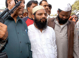 Masood Azahar and Dilawar Khan, both belonging to the Lashkar-e-Toiba, are produced in Tees Hazari Court by the Special Cell of the Delhi police in New Delhi on Sunday. 