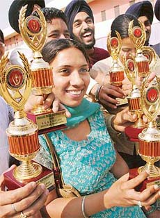 Students of Sri Guru Gobind Singh College, Sector 26, Chandigarh, with the prizes at the annual prize distribution function