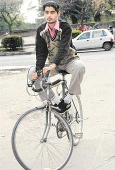 Maninder Singh Thind demonstrates his skill in riding a bicycle without touching the pedals