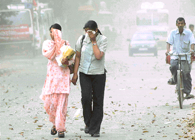 City residents were forced to cover their eyes for protection as strong winds lashed the city on Thursday afternoon.