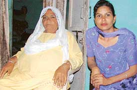 Ajit Kaur(left), wife of Ajmer Singh, who has been lodged in a jail in Pakistan for the past 30 years, along with her daughter, Rashveer Kaur