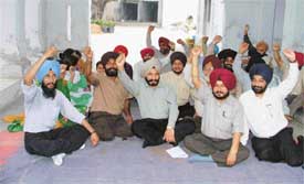 PCCTU teachers stage a dharna in Ludhiana on Thursday