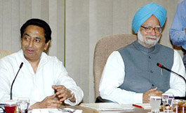 Union Minister for Commerce and Industry Kamal Nath (L) talks to Dr Manmohan Singh during a meeting with  G-20 Ministers  at the PMs residence in New Delhi on Friday.