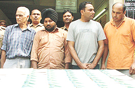 The three accused in the passport racket, G.N. Pahwa, Ranjit Singh and Harshdeep Singh, arrested in the Capital on Friday.