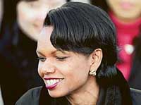 US Secretary of State Condoleezza Rice (R) chats with South Korean university students on her arrival at a military airport south of Seoul, during her visit to South Korea on Saturday.