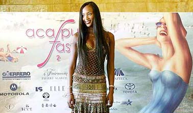 Top British model Naomi Campbell poses for photographers as she arrives at a news conference in Acapulco, Mexico, on Saturday