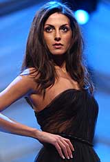 A model presents an outfit by Greek designer Veloudakis 