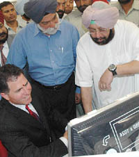 Mr Michael Dell, Chairman of Dell Inc, explains a point to the Punjab Chief Minister, Capt Amarinder Singh, at the inauguration of the third India-based Customer Contact centre at Mohali, near Chandigarh, on Monday. 