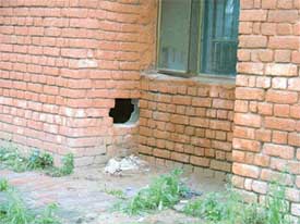 A hole from where three undertrials escaped from the Focal Point police station in Ludhiana on Monday