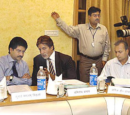 Industrialist Kumaramangalam Birla talks to actor Amitabh Bachchan during a meeting of the Uttar Pradesh Development Council in Lucknow on Tuesday. Reliance Industries Vice-Chairman Anil Ambani is also seen in the picture. The Centre has asked Delhi and Mumbai Police to provide Y-class security to Anil Ambani after he reported receiving threat calls.