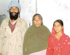 Pinki with her parents in Ludhiana on Tuesday