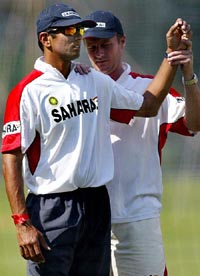 Rahul Dravid  is helped by physio John Gloster during a practice session in Bangalore on Tuesday