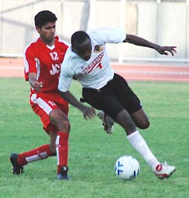 East Bengals E.C. Jeremiah being checked by JCT defender Daljit Singh in a National Football League match at Ludhianas Guru Nanak Stadium on Tuesday. East Bengal won the match 1-0