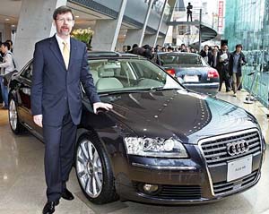 German automaker Audis Japanese subsidiary President Walter Harek introduces the companys flagship luxury sedan, A8 6.0 quattro, a four wheel-drive equipped with a 6.0-litre 12-cylinder engine at the companys showroom in Tokyo on Wednesday. 