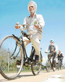 Senior citizens above 70 take part in a 1.5 km cycle race during senior citizens athletic meet at Mohali on Wednesday. 