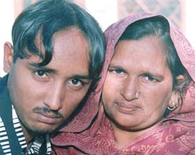Mrs Gian Kaur, hugs her son Nahar Singh, who reached home after being released from a Pakistani Jail, at Alimajra village near Rajpura