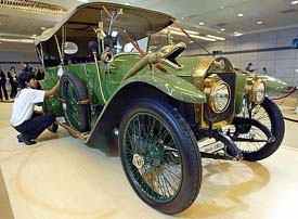 A Thai worker polishes a Mercedes Benz convertible touring car during a media preview of the 26th Bangkok International Motor Show in Bangkok March 24, 2005. 