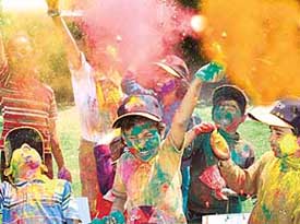 A dash of colour in their life: Students of Bal Niketan, Panchkula, celebrate Holi on Thursday.