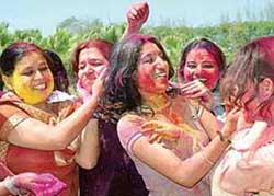 Students enjoy the festival of colours at Panjab University in Chandigarh on Thursday