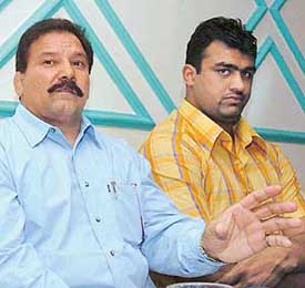 Indias top wrestler, Palwinder Singh Cheema (right) accompanied by former international wrestler Kartar Singh at a press conference in Mohali on Thursday.