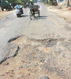 Broken patches of road are a common sight on this route