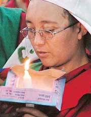 A member of the Tibetan Womens Association participates in Candle Peace March in Chandigarh on Friday.