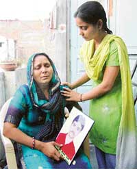 Kiran Devi with her daughter Pooja. Kiran Devis husband Jaipal was killed by militants on Holi in 1992 along with 18 persons
