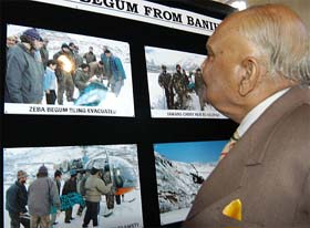 Lieut-Gen (retd) S.K. Sinha, Governor of Jammu and Kashmir, looks at pictures at an exhibition at the Amar Singh Club, Srinagar