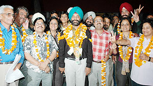 Mr Jagtar Singh Sidhu, newly elected president of the Chandigarh Press Club, with his team on Sunday.