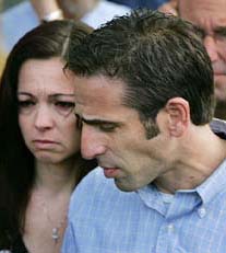 Bobby Schindler, brother of brain-damaged Florida woman Terri Schiavo, and his sister Suzanne Vitadamo, finish a press conference in front of the Woodside Hospice, Florida, on Saturday