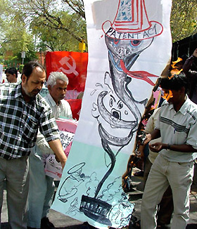 Activists of CPI burning an effigy of Prime Minister Manmohan Singh in protest against the amendments to the Patents Bill at Jantar Mantar in the Capital on Monday