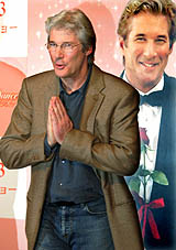 Hollywood actor Richard Gere gestures at a news conference