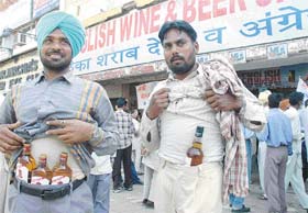 Communist workers buy their quota of liquor from a Sector 22 wine shop in Chandigarh