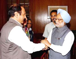 Prime Minister Manmohan Singh greets former Pakistan Prime Minister Chaudhary Shujaat Hussain in New Delhi on Tuesday.