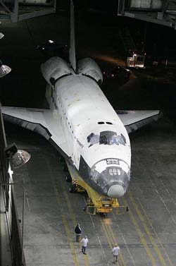 Space shuttle Discovery arrives in the Vehicle Assembly Building after being transported from the Orbiter Processing Facility at the Kennedy Space Center in Florida