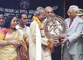 The Haryana Governor, Dr A.R. Kidwai, gives Koser award to Mani Lal Nag at the Tagore Theatre