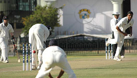Railways' Yere Gaud is trapped leg before wicket by seamer V.R.V. Singh on the first day of the Ranji Trophy Elite group final match at the PCA Stadim in Mohali