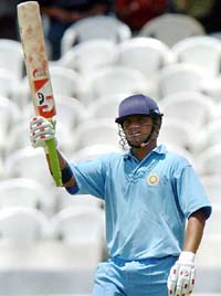 Suresh Raina of India A raises his bat after reaching his half century against Pakistan 