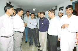 Employees of the Haryana Secretariat in a pensive mood after hearing the helicopter crash news in which Mr O.P. Jindal and Mr Surinder Singh were killed in Chandigarh 