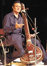 Dr Karan Singh, MP, paying a musical tribute to K. L. Saigal at a function in the Capital on Thursday.