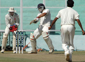 Punjabs Reetinder Sodhi plays a cut shot off Madan Yadav of Railways on the second day of the Ranji Trophy Elite Group final at the PCA Stadium in Mohali 