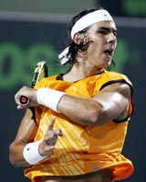 Rafael Nadal of Spain hits a forehand shot against Thomas Johansson of Sweden during their quarterfinal at the Nasdaq-100 tennis tournament in Key Biscayne