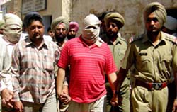 Kanta (in T-Shirt) and Sukha (extreme left) being taken for production to a Rajpura court on Friday. 