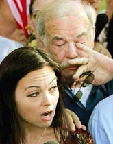 Suzanne Vitadamo (left), sister of brain-damaged Florida woman Terri Schiavo, speaks to the media accompanied by her father Bob Schindler in front of the Woodside Hospice where Schiavo died on Thursday.