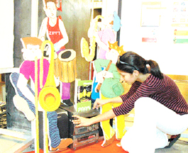 A student with one of her exhibits at Government Art College, Chandigarh.