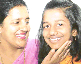 Swati Jindal, who topped the Class VIII examination on Friday, with her mother in Chandigarh on Saturday. 