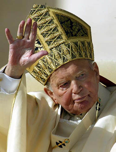Pope John Paul ll waves during a consistory in Saint Peter's Square at the Vatican on October 21, 2003. 